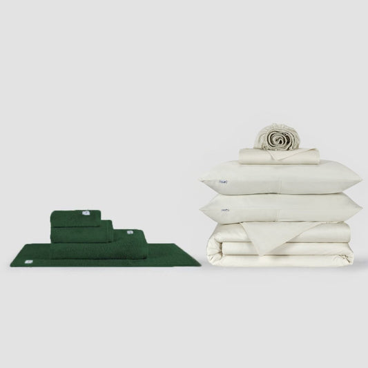 Green towel set and white bed sheets bundle displayed on neutral background by Momo Cotton